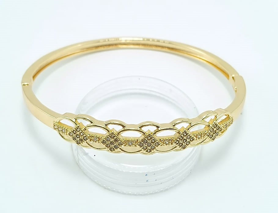 Brazalete rodinado con circones dorado